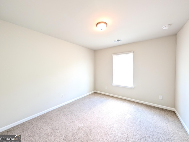 120 Magnaview Dr, Mcdonough, GA 30253 - carpeted spare room with baseboards and a smoke detector
