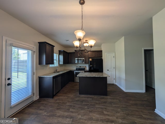 120 Magnaview Dr, Mcdonough, GA 30253 - kitchen featuring appliances with stainless steel finishes, a center island, dark wood-type flooring, and pendant lighting