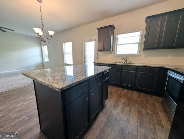 120 Magnaview Dr, Mcdonough, GA 30253 - kitchen featuring stainless steel electric range, open floor plan, a center island, dark wood finished floors, and a chandelier