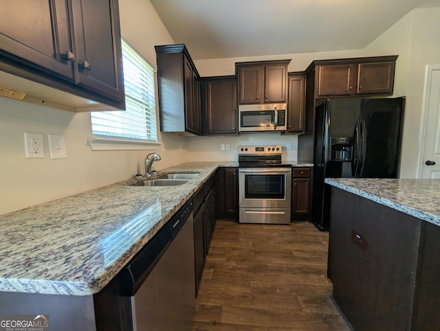 120 Magnaview Dr, Mcdonough, GA 30253 - kitchen featuring stainless steel appliances, dark wood-style flooring, dark brown cabinetry, and light stone counters