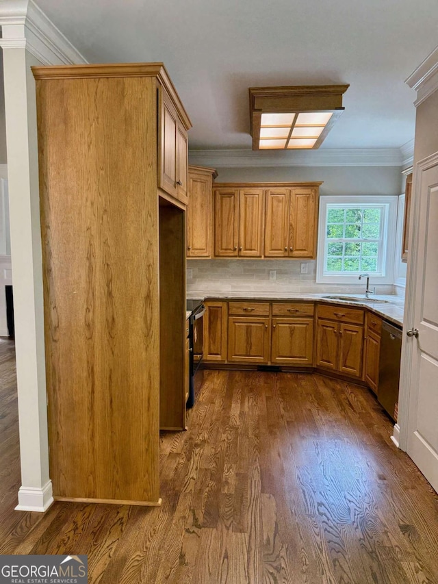205 Huntington Shoals Dr, Athens, GA 30606 - kitchen featuring stainless steel appliances, brown cabinets, dark wood-style flooring, crown molding, and light countertops