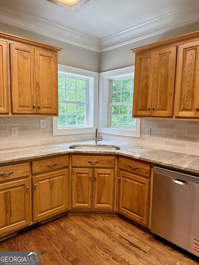 205 Huntington Shoals Dr, Athens, GA 30606 - kitchen featuring stainless steel dishwasher, plenty of natural light, brown cabinets, and ornamental molding