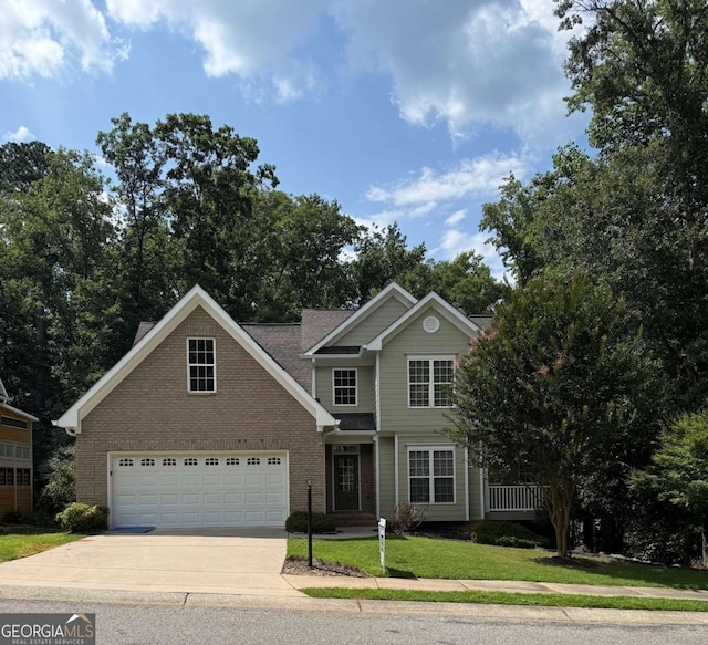 205 Huntington Shoals Dr, Athens, GA 30606 - traditional-style home featuring concrete driveway, brick siding, and a front yard