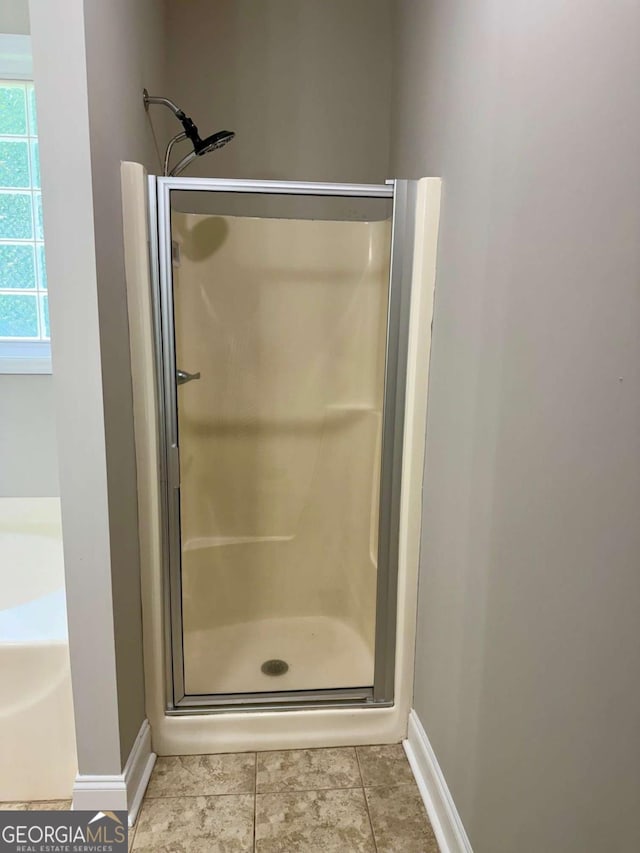 205 Huntington Shoals Dr, Athens, GA 30606 - bathroom featuring a stall shower and tile patterned flooring