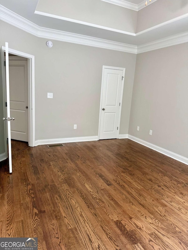 205 Huntington Shoals Dr, Athens, GA 30606 - spare room featuring dark wood finished floors, crown molding, and a raised ceiling