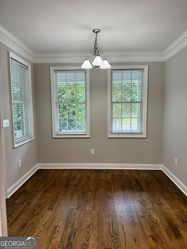 205 Huntington Shoals Dr, Athens, GA 30606 - unfurnished room with a chandelier, healthy amount of natural light, ornamental molding, and dark wood finished floors