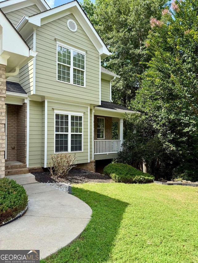 205 Huntington Shoals Dr, Athens, GA 30606 - view of front of house featuring a front lawn, covered porch, and brick siding