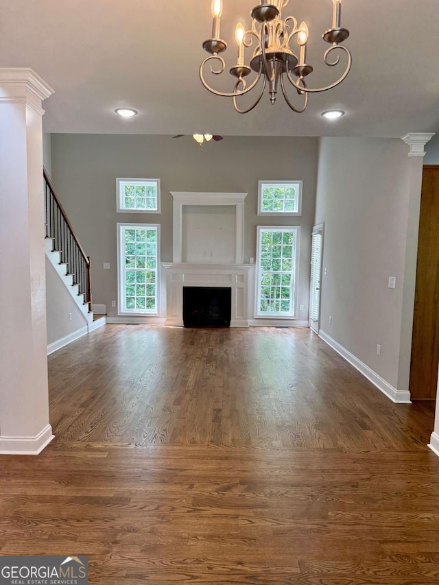 205 Huntington Shoals Dr, Athens, GA 30606 - unfurnished living room featuring plenty of natural light, a chandelier, wood finished floors, and a fireplace