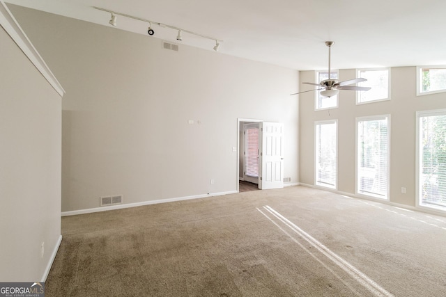 6290 Shallowford Way, Douglasville, GA 30135 - carpeted spare room with rail lighting, ceiling fan, and a high ceiling