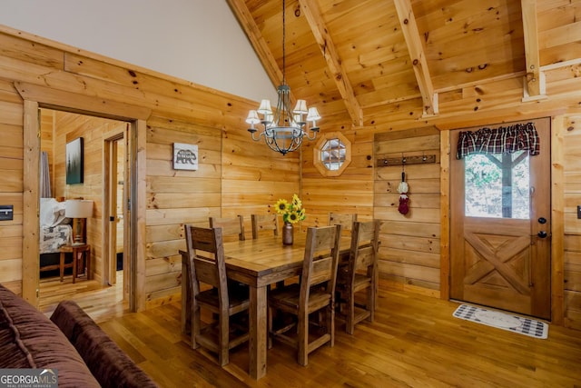 105 Ranch Mountain Ct, Dahlonega, GA 30533 - dining space with wood ceiling, a chandelier, wood walls, and wood finished floors