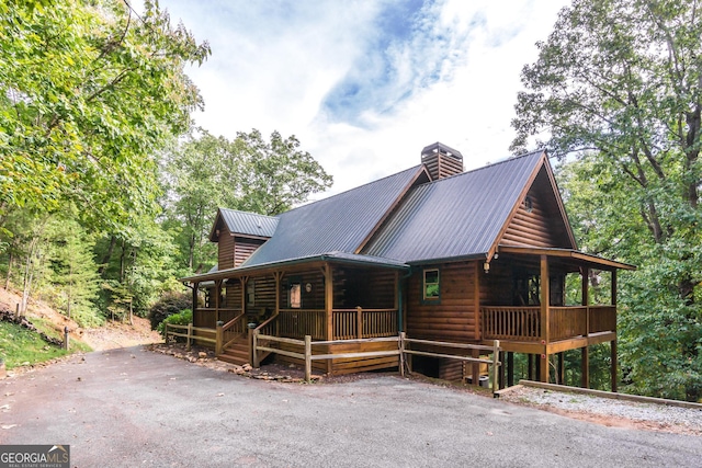 105 Ranch Mountain Ct, Dahlonega, GA 30533 - view of front of home featuring covered porch, a chimney, and a metal roof