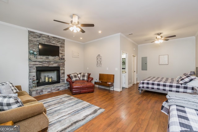 105 Ranch Mountain Ct, Dahlonega, GA 30533 - living room with ceiling fan, electric panel, wood finished floors, a fireplace, and ornamental molding