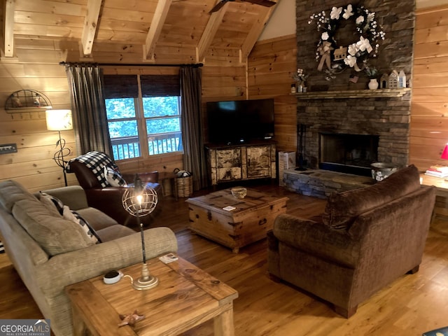 105 Ranch Mountain Ct, Dahlonega, GA 30533 - living area featuring wood walls, wood finished floors, a stone fireplace, and wooden ceiling
