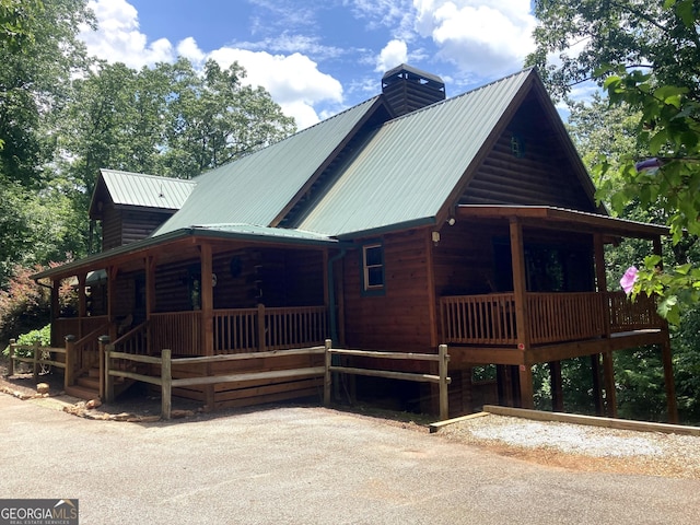 105 Ranch Mountain Ct, Dahlonega, GA 30533 - view of front of home featuring a porch, a metal roof, and a chimney