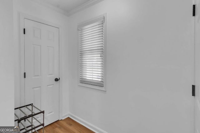 1481 Howard Way, Lawrenceville, GA 30043 - hallway featuring wood finished floors and ornamental molding