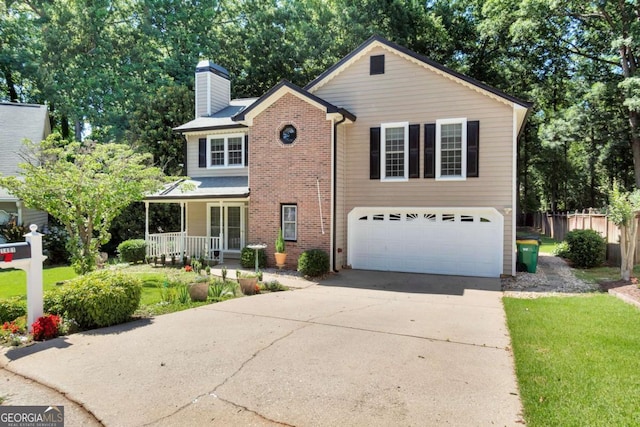 1481 Howard Way, Lawrenceville, GA 30043 - traditional home featuring a chimney, a porch, concrete driveway, an attached garage, and brick siding