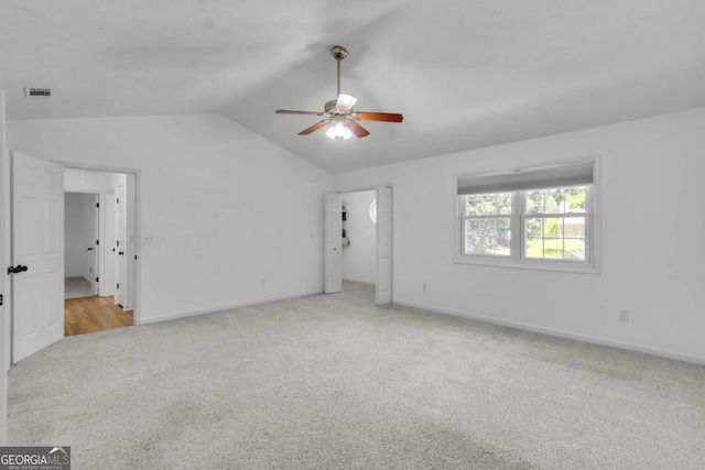 1481 Howard Way, Lawrenceville, GA 30043 - unfurnished living room featuring carpet floors, lofted ceiling, and a ceiling fan