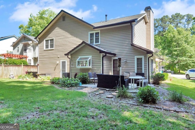 1481 Howard Way, Lawrenceville, GA 30043 - rear view of house with a chimney, outdoor lounge area, and a patio area