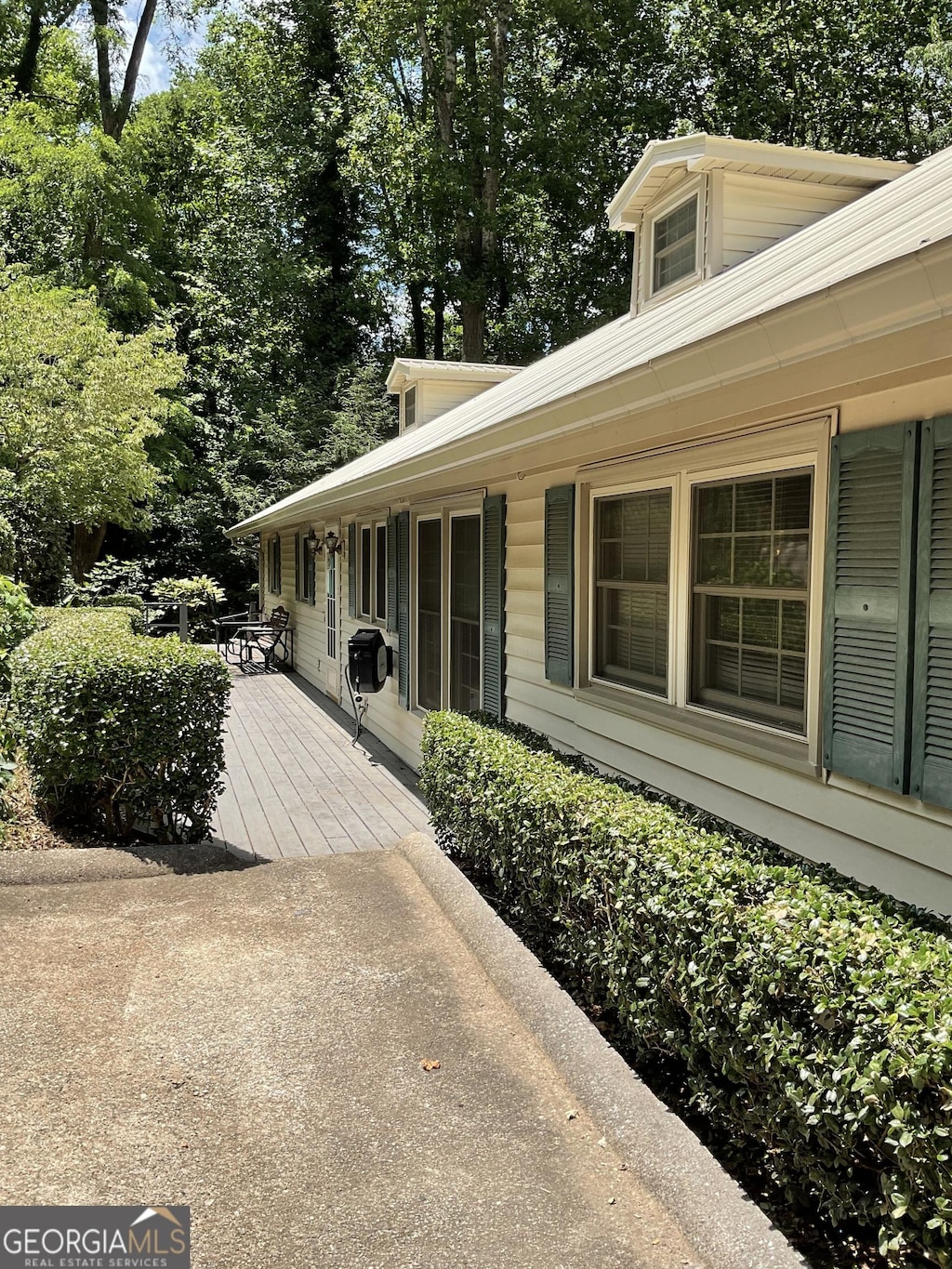 866 Yunai Cir, Clayton, GA 30525 - view of home's exterior featuring a deck and view of scattered trees
