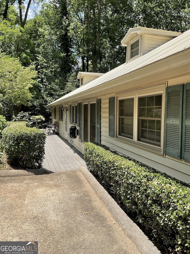 866 Yunai Cir, Clayton, GA 30525 - view of home's exterior featuring a deck and view of scattered trees