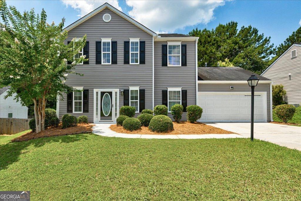 3953 Willow Fields Ct, Loganville, GA 30052 - view of front of property with an attached garage and driveway