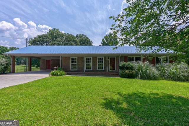 1131 Treadwell Bridge Rd, Statham, GA 30666 - ranch-style home with a carport, a front yard, driveway, brick siding, and a metal roof