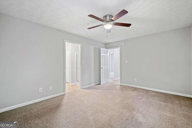 3997 Paloverde Dr NW, Kennesaw, GA 30144 - spare room featuring a ceiling fan, light colored carpet, and a textured ceiling