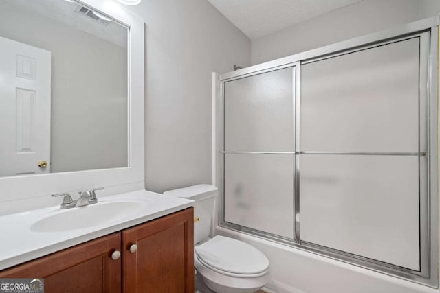 3997 Paloverde Dr NW, Kennesaw, GA 30144 - full bathroom featuring vanity, bath / shower combo with glass door, and a textured ceiling