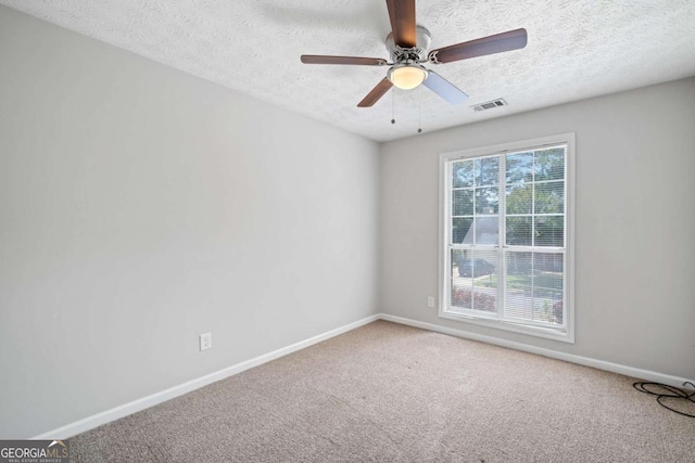 3997 Paloverde Dr NW, Kennesaw, GA 30144 - carpeted empty room with a textured ceiling and ceiling fan