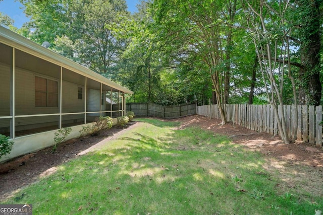 3997 Paloverde Dr NW, Kennesaw, GA 30144 - fenced backyard with a sunroom