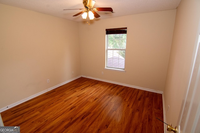 214 Hunters Chase, Byron, GA 31008 - empty room with wood finished floors, ceiling fan, and a textured ceiling