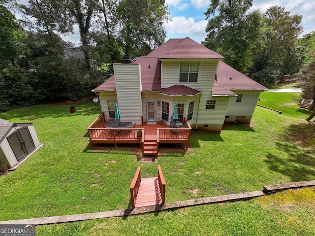 214 Hunters Chase, Byron, GA 31008 - rear view of property featuring a chimney, crawl space, a deck, a yard, and a storage shed