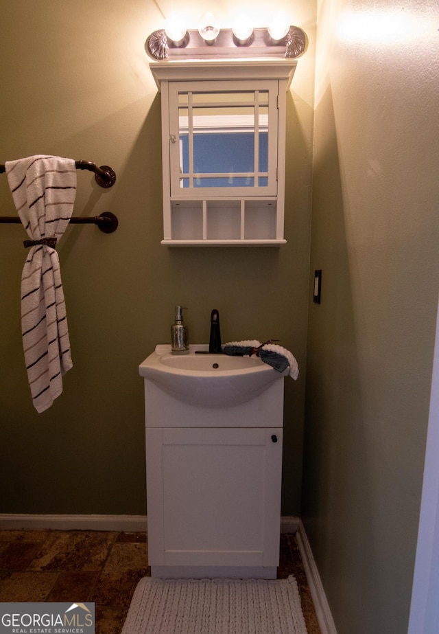 214 Hunters Chase, Byron, GA 31008 - bathroom with vanity and baseboards