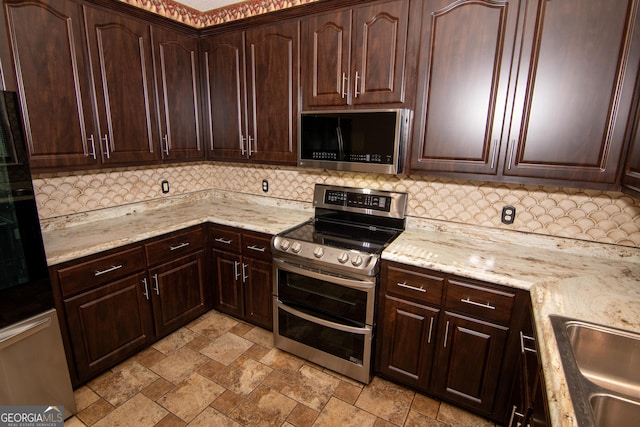 214 Hunters Chase, Byron, GA 31008 - kitchen with appliances with stainless steel finishes, tasteful backsplash, light stone finish flooring, and light stone countertops