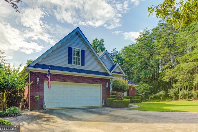 219 John Garner Rd, Dahlonega, GA 30533 - traditional-style house with concrete driveway, brick siding, a garage, a standing seam roof, and a metal roof