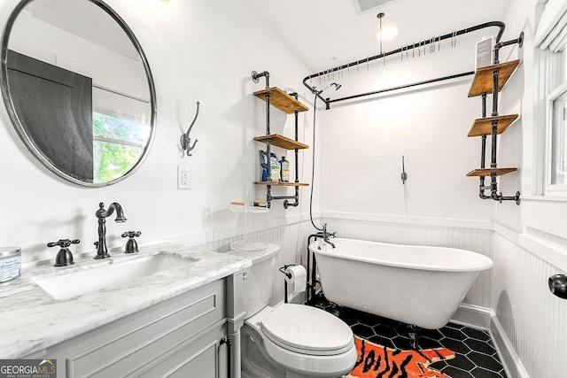 216 Leyden St, Decatur, GA 30030 - full bath with a soaking tub, vanity, a wainscoted wall, and tile patterned flooring