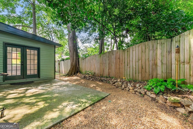 216 Leyden St, Decatur, GA 30030 - fenced backyard with french doors and a patio area