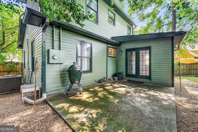 216 Leyden St, Decatur, GA 30030 - back of property with french doors and a patio