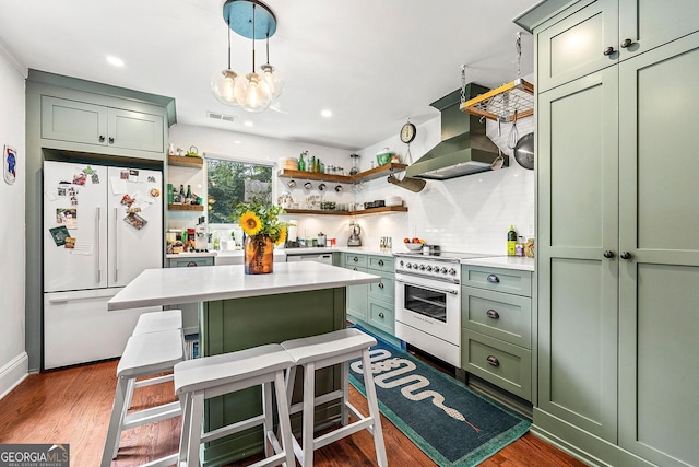 216 Leyden St, Decatur, GA 30030 - kitchen with green cabinets, white refrigerator, island exhaust hood, electric stove, and open shelves