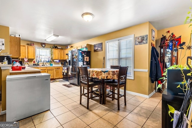 281 Northwinds Blvd Unit D-3, Carrollton, GA 30197 - dining room with light tile patterned floors and baseboards