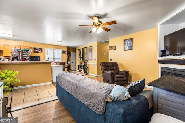281 Northwinds Blvd Unit D-3, Carrollton, GA 30197 - living room featuring a ceiling fan and baseboards