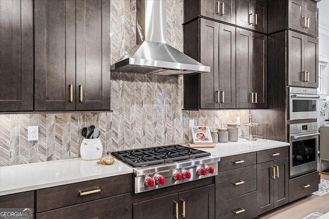 410 Anglin Walk, Alpharetta, GA 30009 - kitchen with wall chimney exhaust hood, stainless steel appliances, backsplash, and light countertops