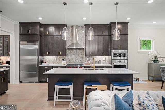 410 Anglin Walk, Alpharetta, GA 30009 - kitchen with stainless steel appliances, wall chimney exhaust hood, crown molding, decorative backsplash, and light countertops