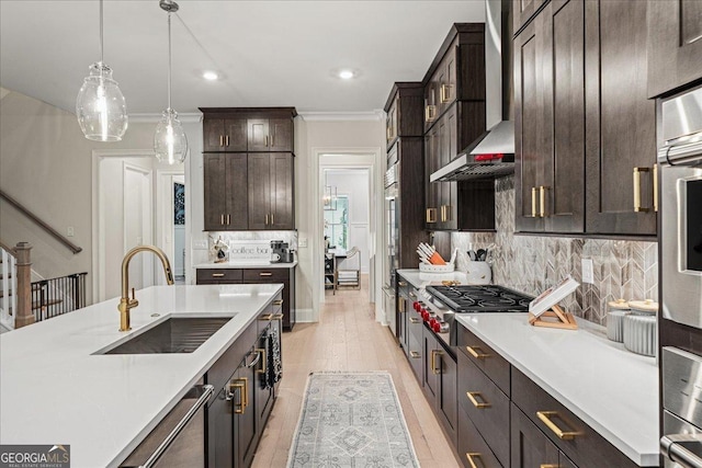 410 Anglin Walk, Alpharetta, GA 30009 - kitchen with wall chimney exhaust hood, stainless steel gas cooktop, light countertops, ornamental molding, and recessed lighting
