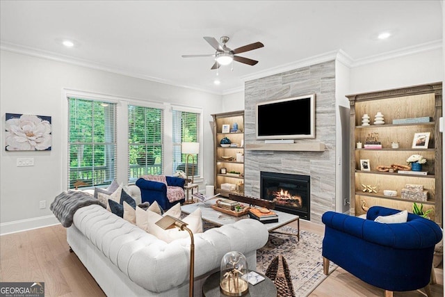 410 Anglin Walk, Alpharetta, GA 30009 - living room with a premium fireplace, ceiling fan, wood finished floors, ornamental molding, and recessed lighting
