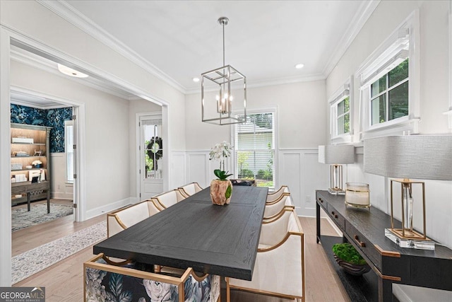 410 Anglin Walk, Alpharetta, GA 30009 - dining area with plenty of natural light, a chandelier, a decorative wall, wainscoting, and wood finished floors