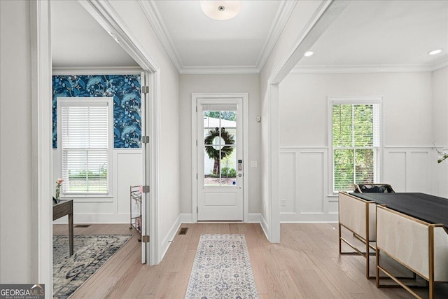 410 Anglin Walk, Alpharetta, GA 30009 - foyer entrance with a decorative wall, wainscoting, light wood-type flooring, and ornamental molding
