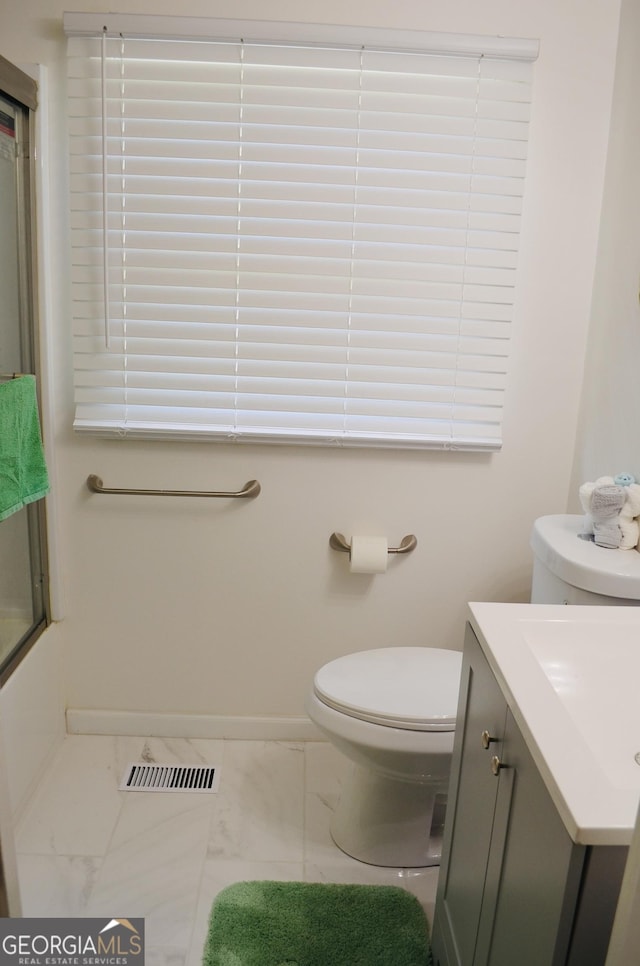 4447 Pharr Ave Unit 0, Macon, GA 31204 - full bathroom featuring marble look tile flooring, vanity, and a shower with shower door