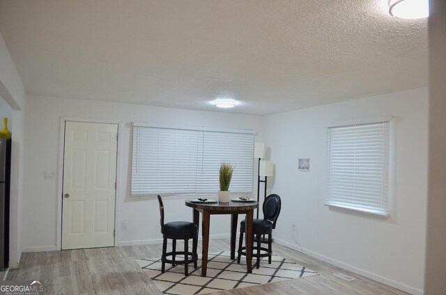 4447 Pharr Ave Unit 0, Macon, GA 31204 - dining area featuring light wood finished floors and a textured ceiling