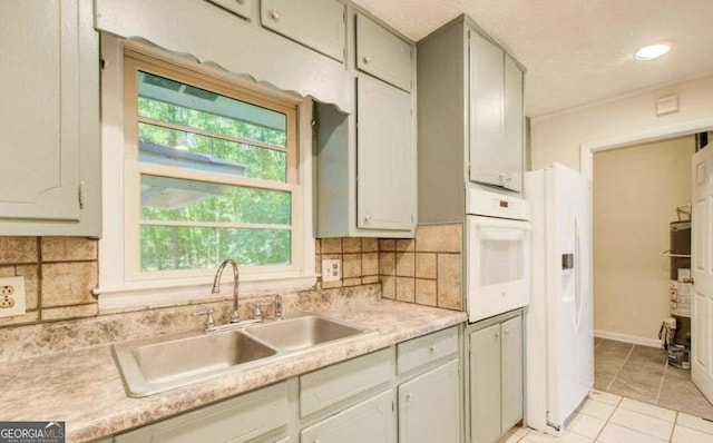 445 Pine Knl, Monroe, GA 30655 - kitchen featuring white appliances, backsplash, and healthy amount of natural light